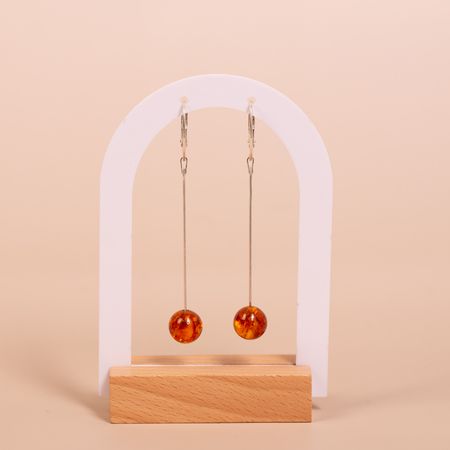 Kolczyki srebrne wiszące z bursztynową kulką