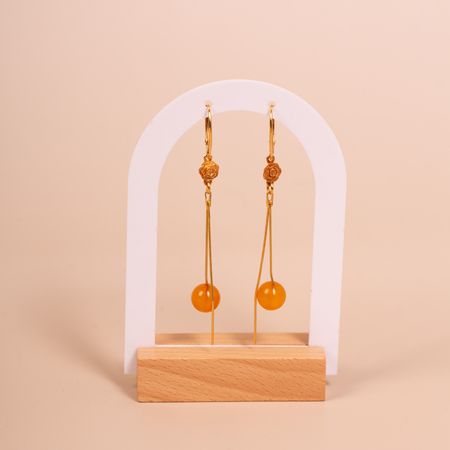 Kolczyki srebrne pozłacane wiszące z bursztynową kulką